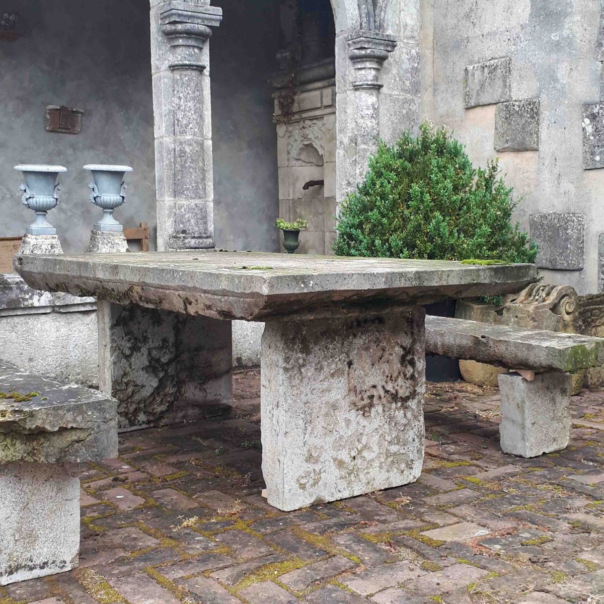 Old natural stone garden table with benches - Piet Jonker Old natural stone garden table with benches - Piet Jonker