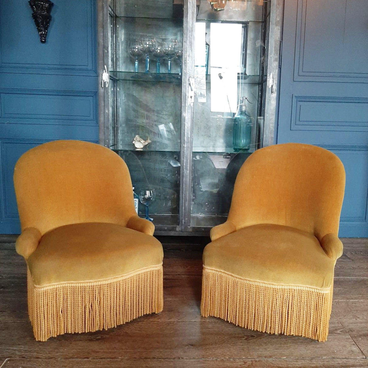 A pair of yellow velvet chairs with fringes Piet Jonker