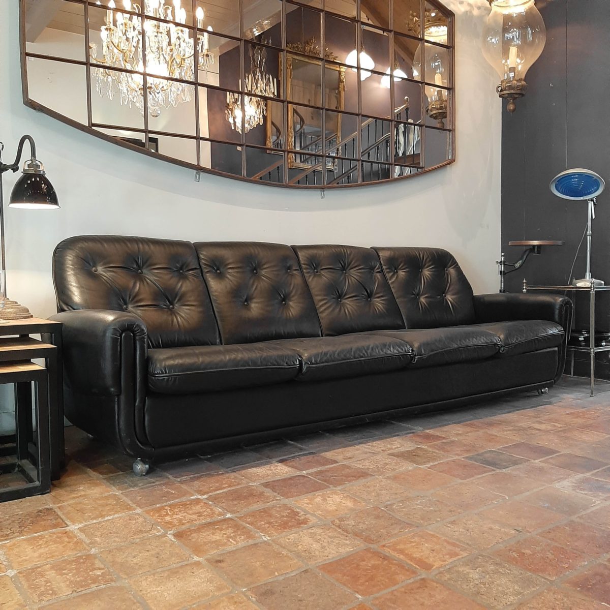 Vintage fourseater sofa made of black leather Piet Jonker