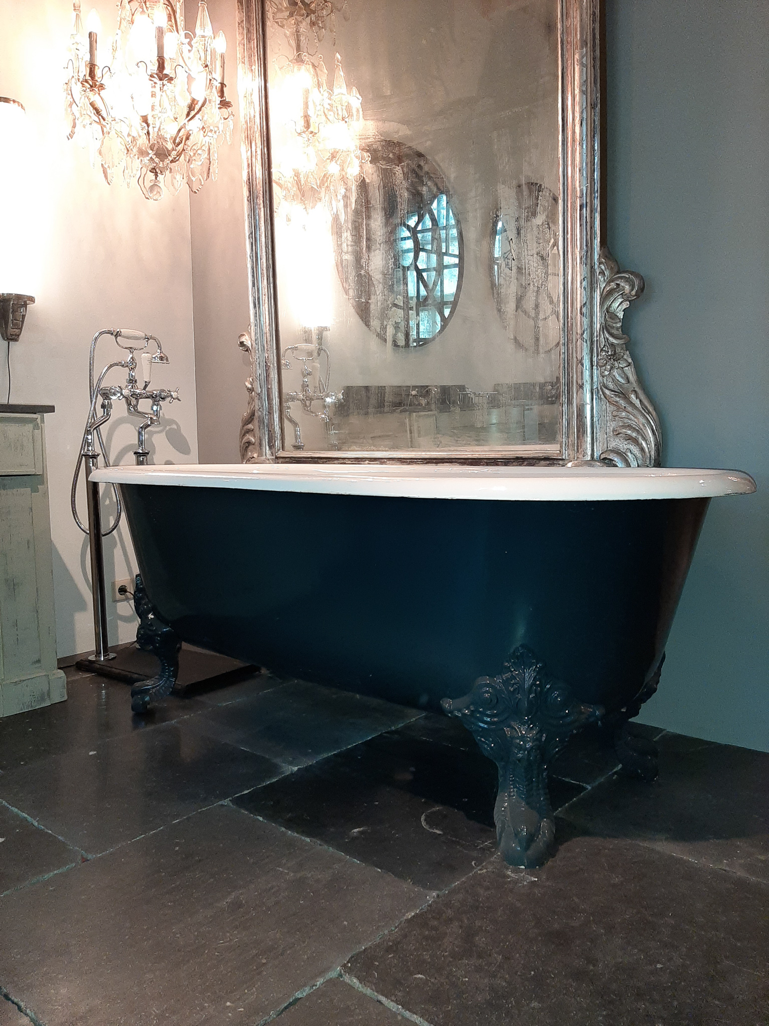 Antique cast iron bath on claw feet Piet Jonker