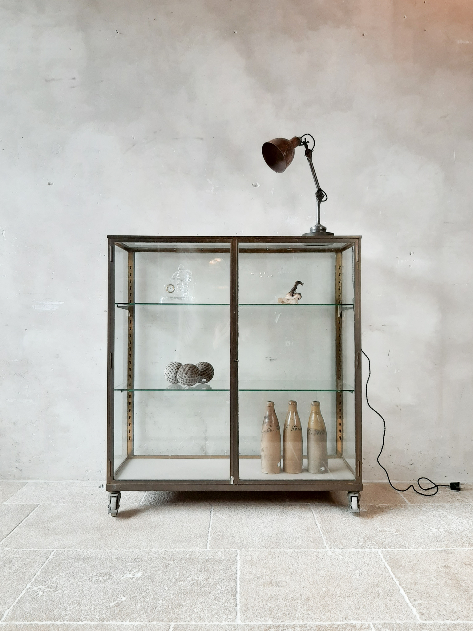 Vintage display made of brass and glass Piet Jonker